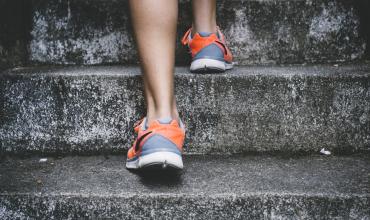 Hoping to Move Up? Here’s How to Sell Your Current Home Fast an athlete running up stairs